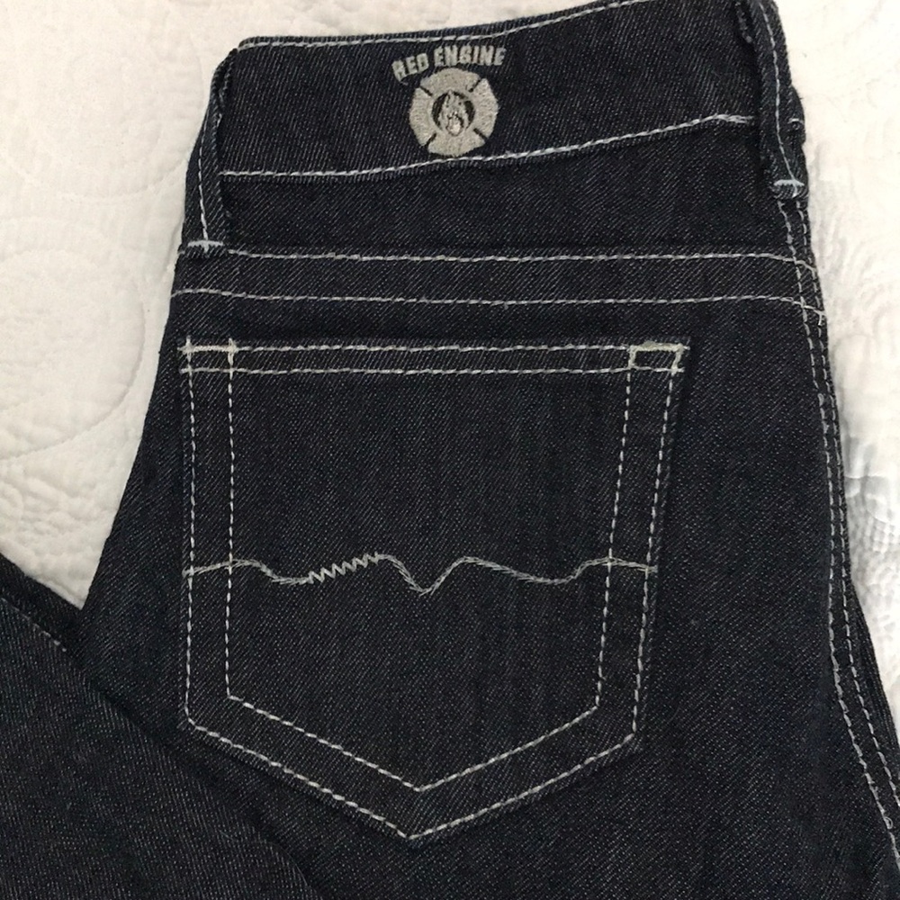 Never worn .Red engine. Metallic silver stitching.